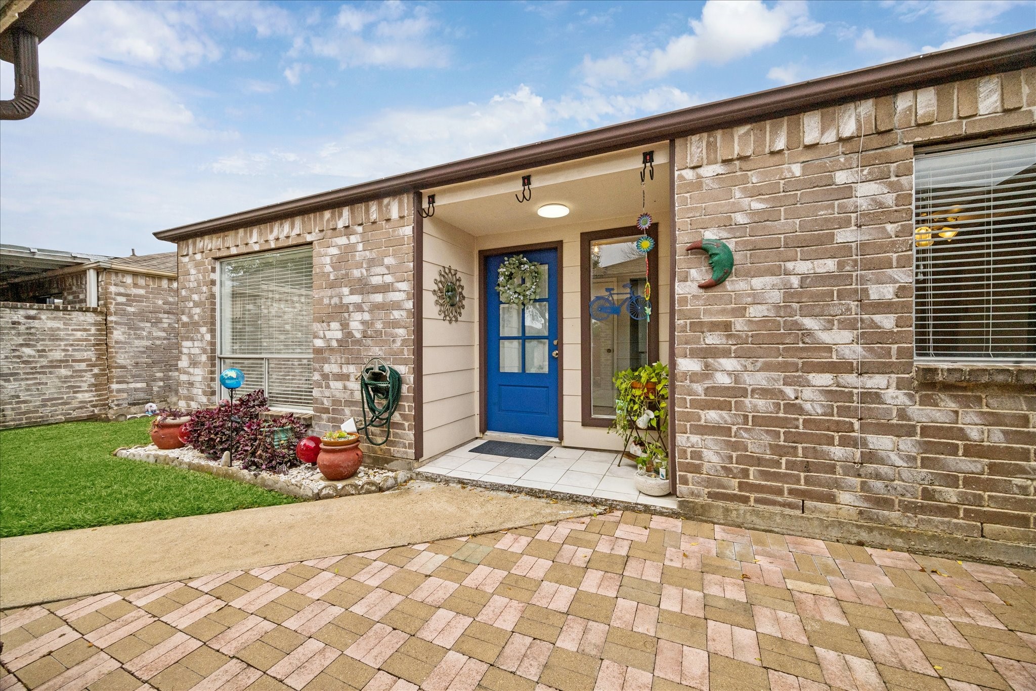 9306 Riverside Lodge Drive Houston, TX 77083 - Photo 5 of 20 a front view of a house with a porch