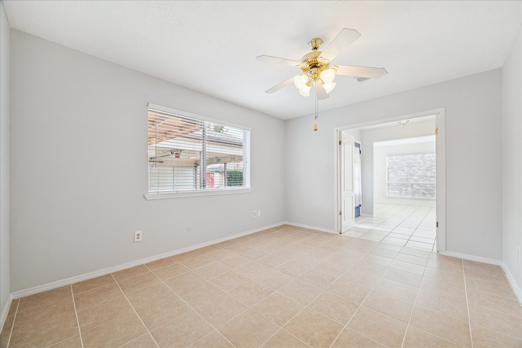 9306 Riverside Lodge Drive Houston, TX 77083 - Photo 8 of 20 a view of an empty room with a window