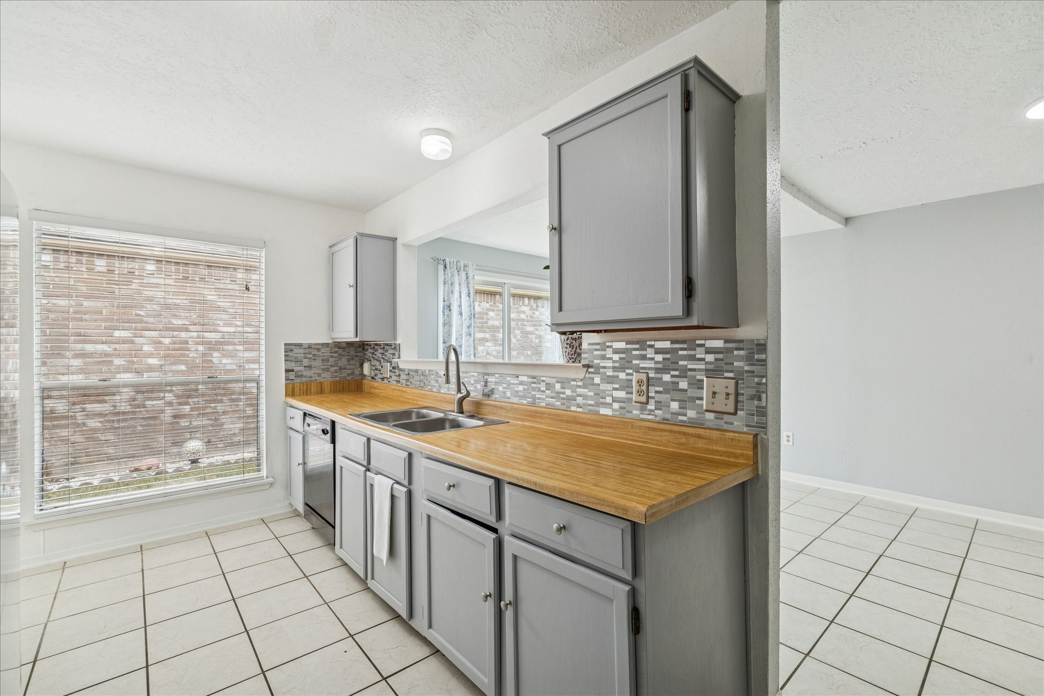 9306 Riverside Lodge Drive Houston, TX 77083 - Photo 9 of 20 a bathroom with a granite countertop sink and a mirror