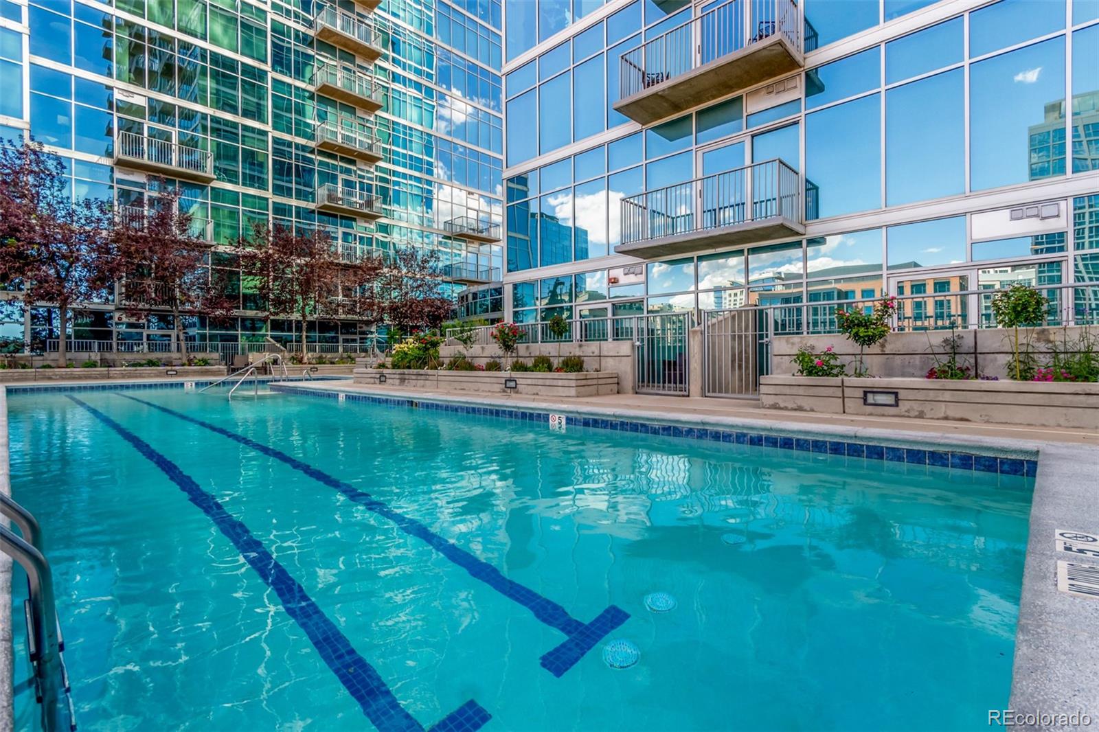 1700 Bassett Street, Unit 1412 Denver, CO 80202 - Photo 27 of 43 a swimming pool view with a outdoor seating