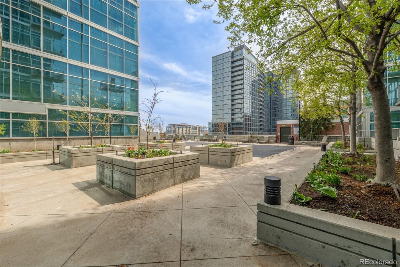 1700 Bassett Street, Unit 1412 Denver, CO 80202 - Photo 28 of 43 a large white building with a yard