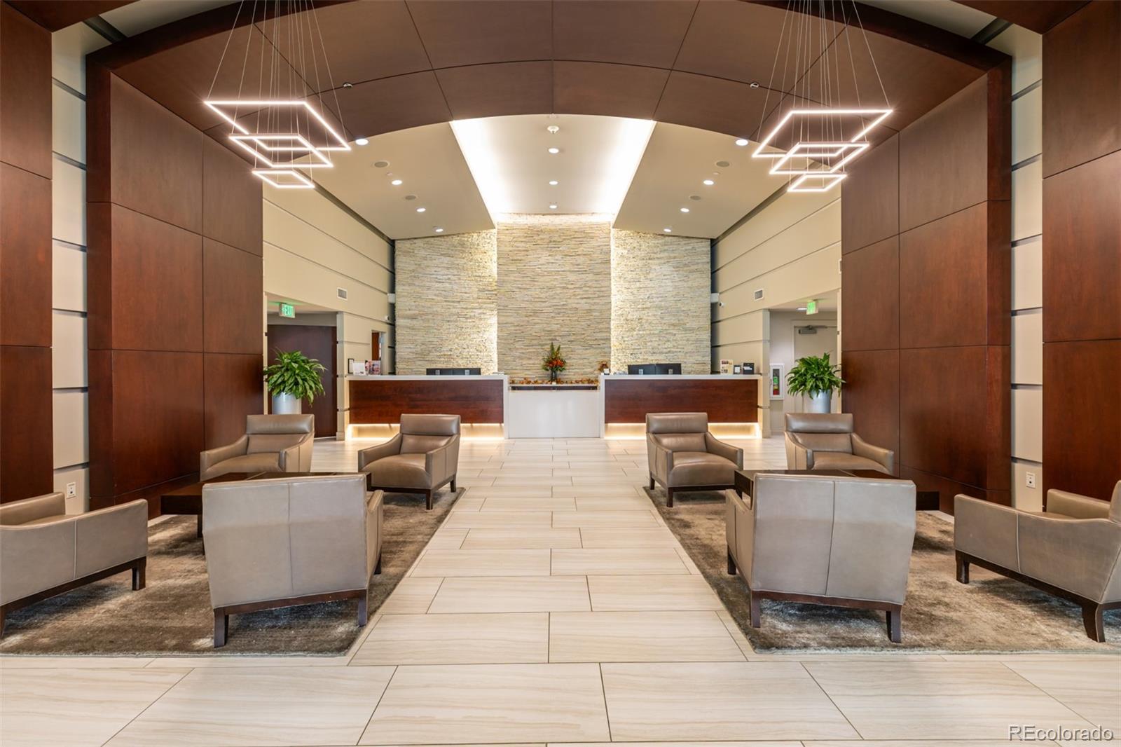 1700 Bassett Street, Unit 1412 Denver, CO 80202 - Photo 32 of 43 a living room with furniture and a chandelier