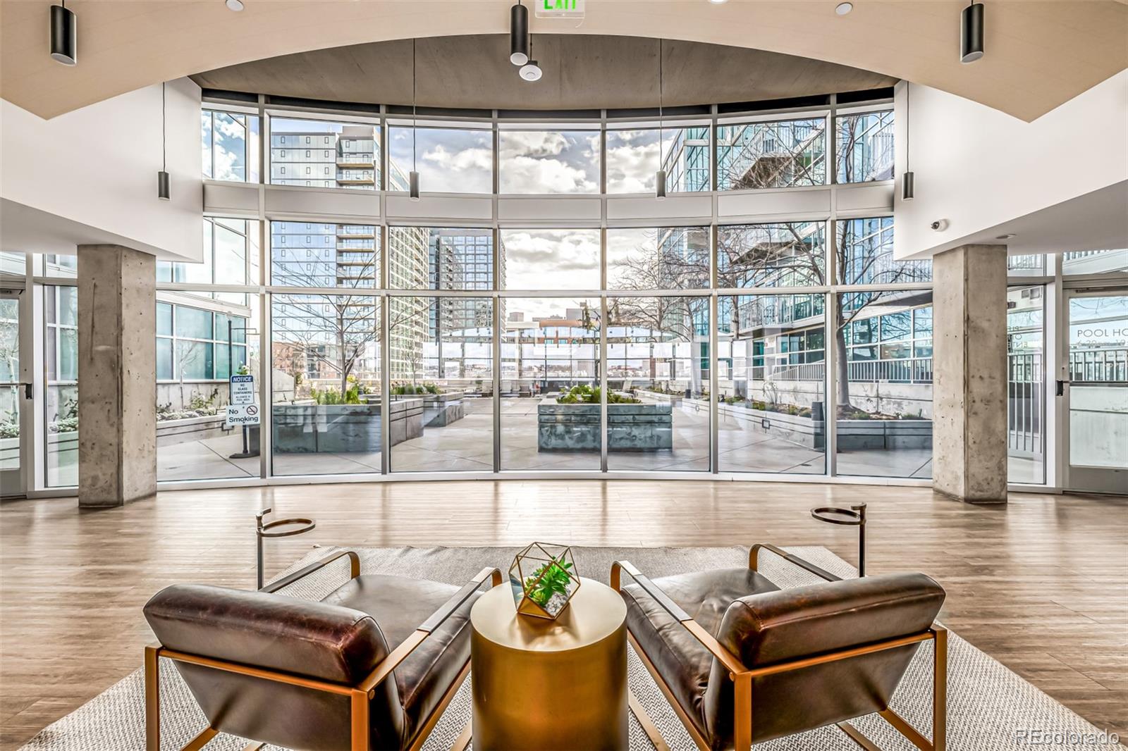 1700 Bassett Street, Unit 1412 Denver, CO 80202 - Photo 33 of 43 a living room with furniture and a floor to ceiling window