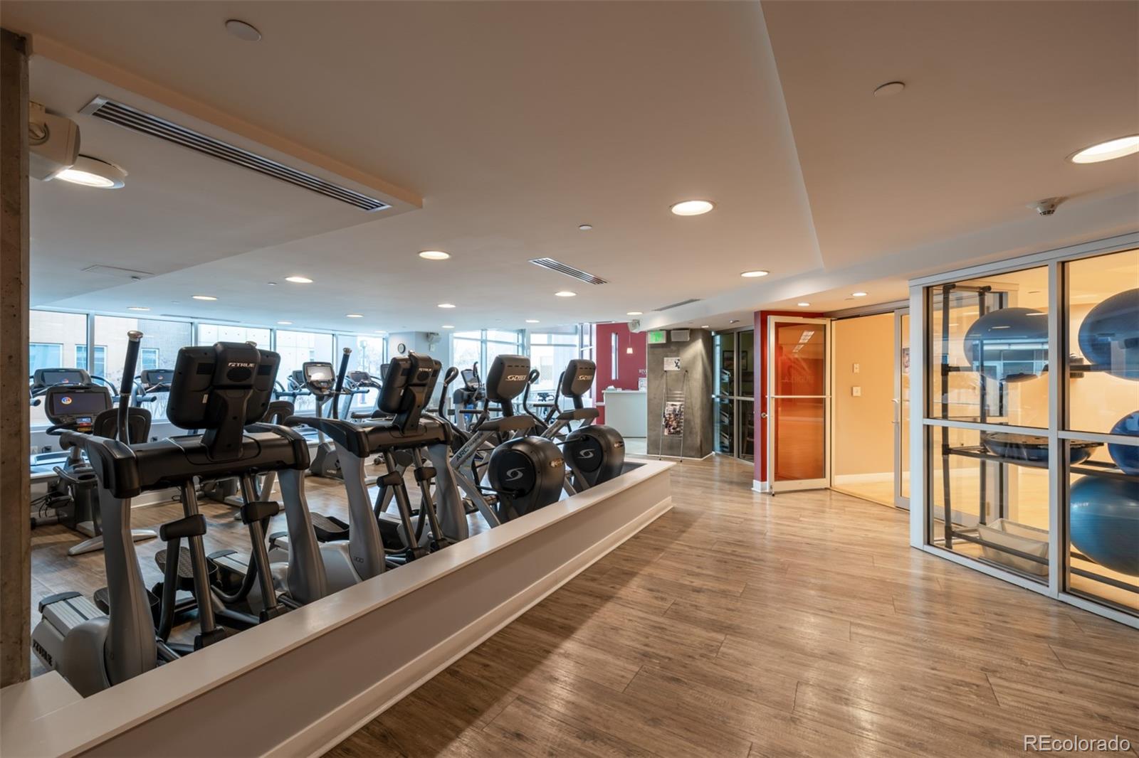 1700 Bassett Street, Unit 1412 Denver, CO 80202 - Photo 37 of 43 a view of a room with lots of wooden furniture