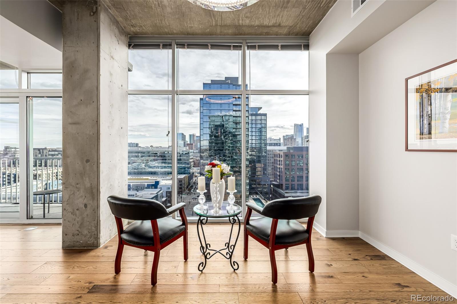 1700 Bassett Street, Unit 1412 Denver, CO 80202 - Photo 6 of 43 a dining room with furniture and wooden floor