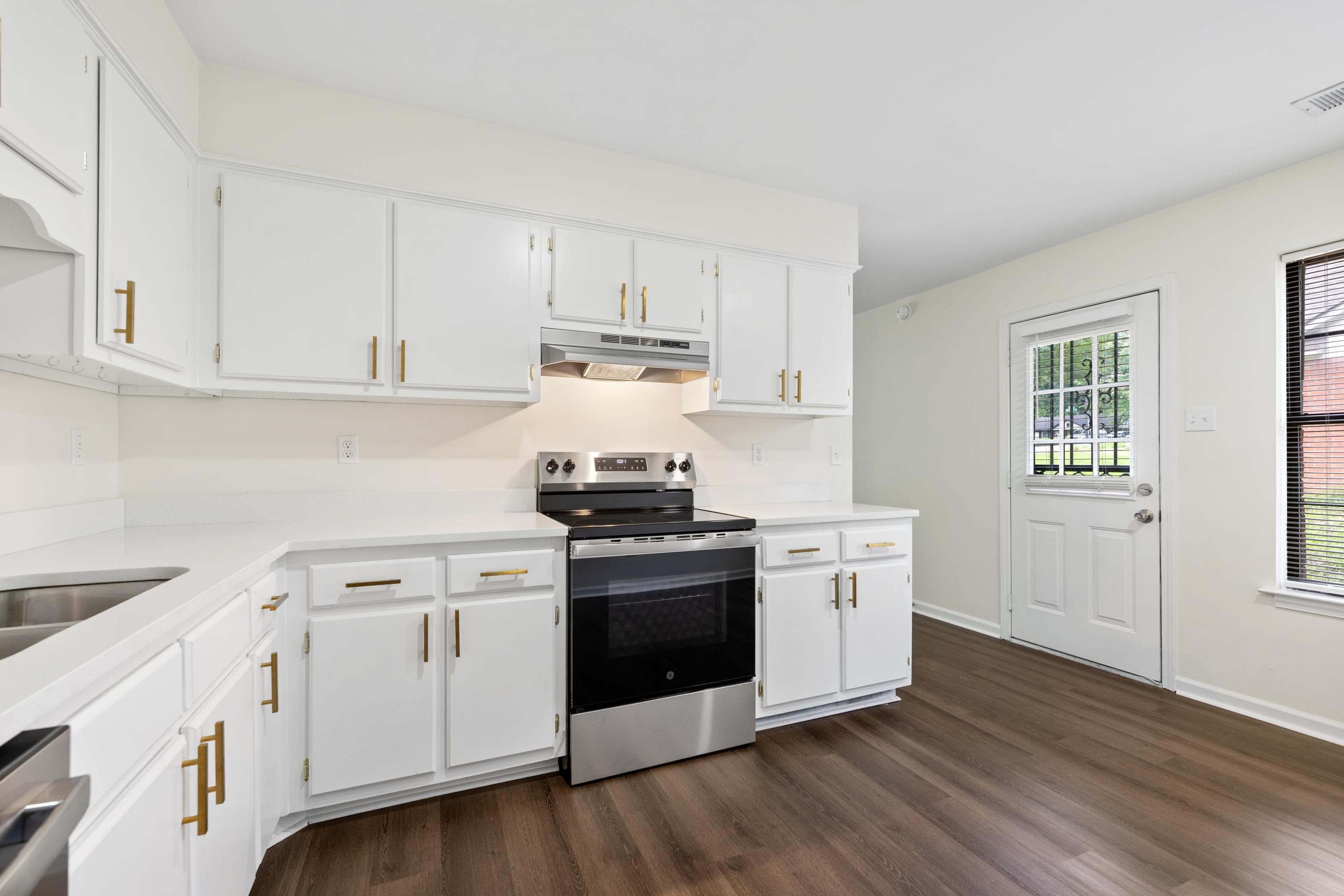 6400 Saginaw Road Memphis, TN 38134 - Photo 5 of 27 Spacious kitchen with ample cabinet space, updated appliances, and easy access to the backyard and outdoor living areas.