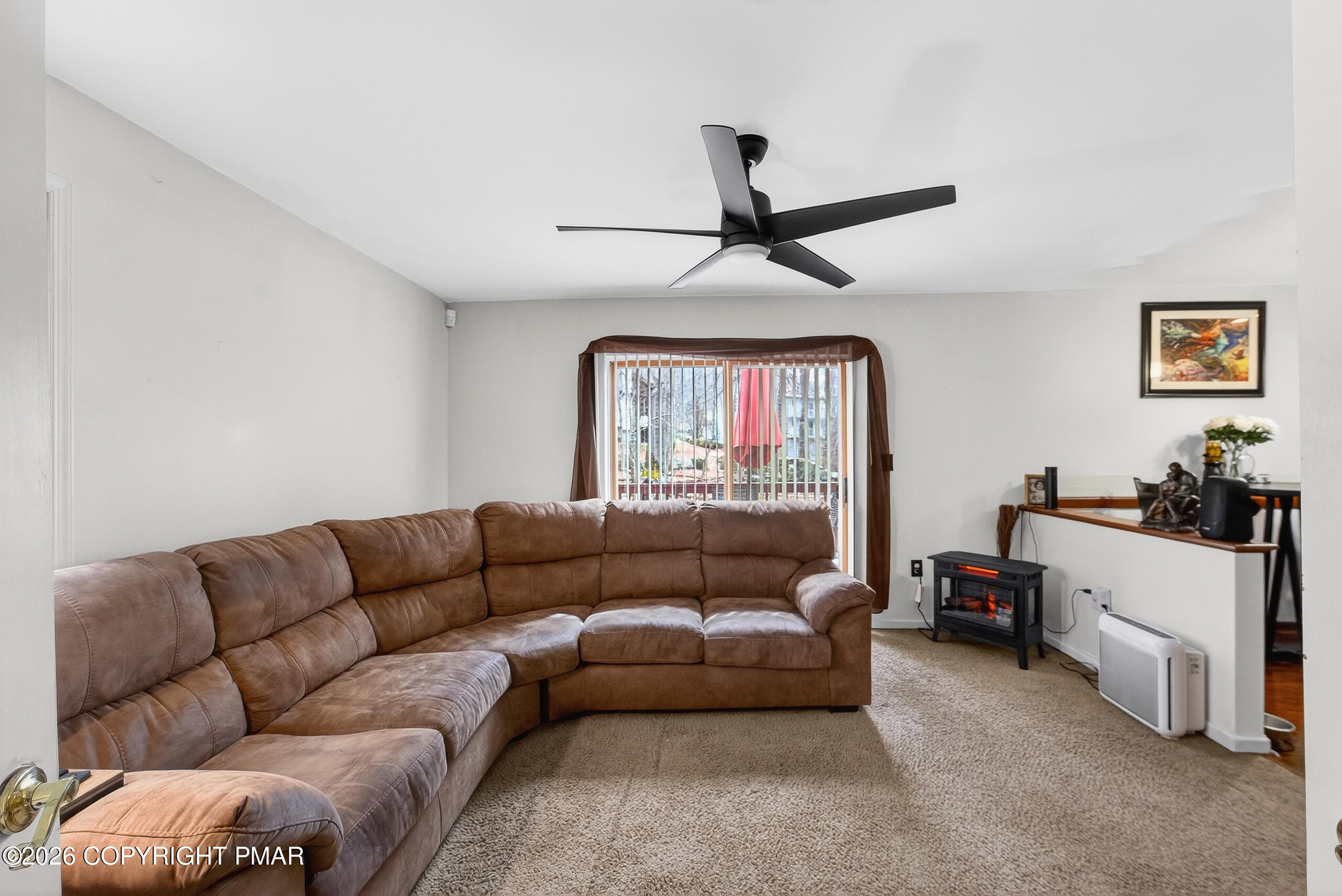 6293 Decker Road Bushkill, PA 18324 - Photo 14 of 38 a living room with furniture and a flat screen tv