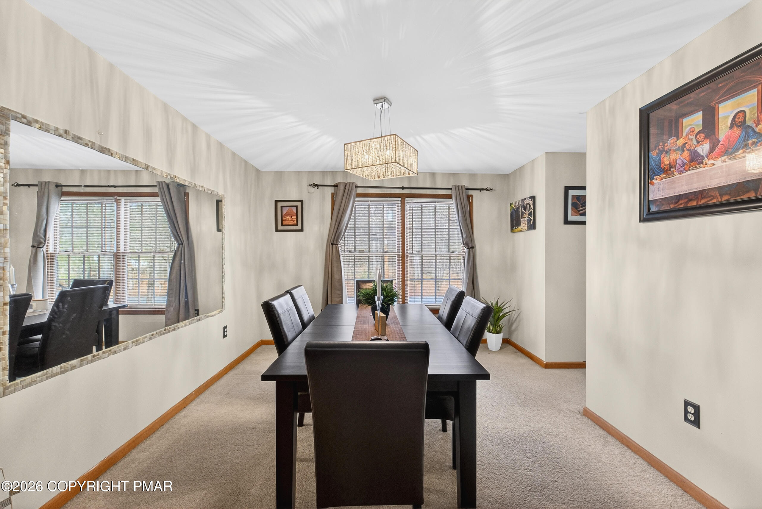 6293 Decker Road Bushkill, PA 18324 - Photo 20 of 38 a living room with furniture a chandelier and a large window