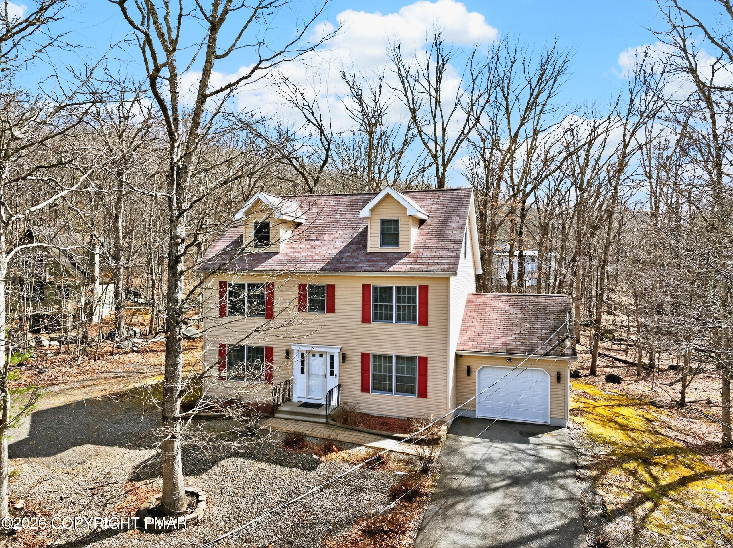 6293 Decker Road Bushkill, PA 18324 - Photo 2 of 38 a front view of a house with a yard