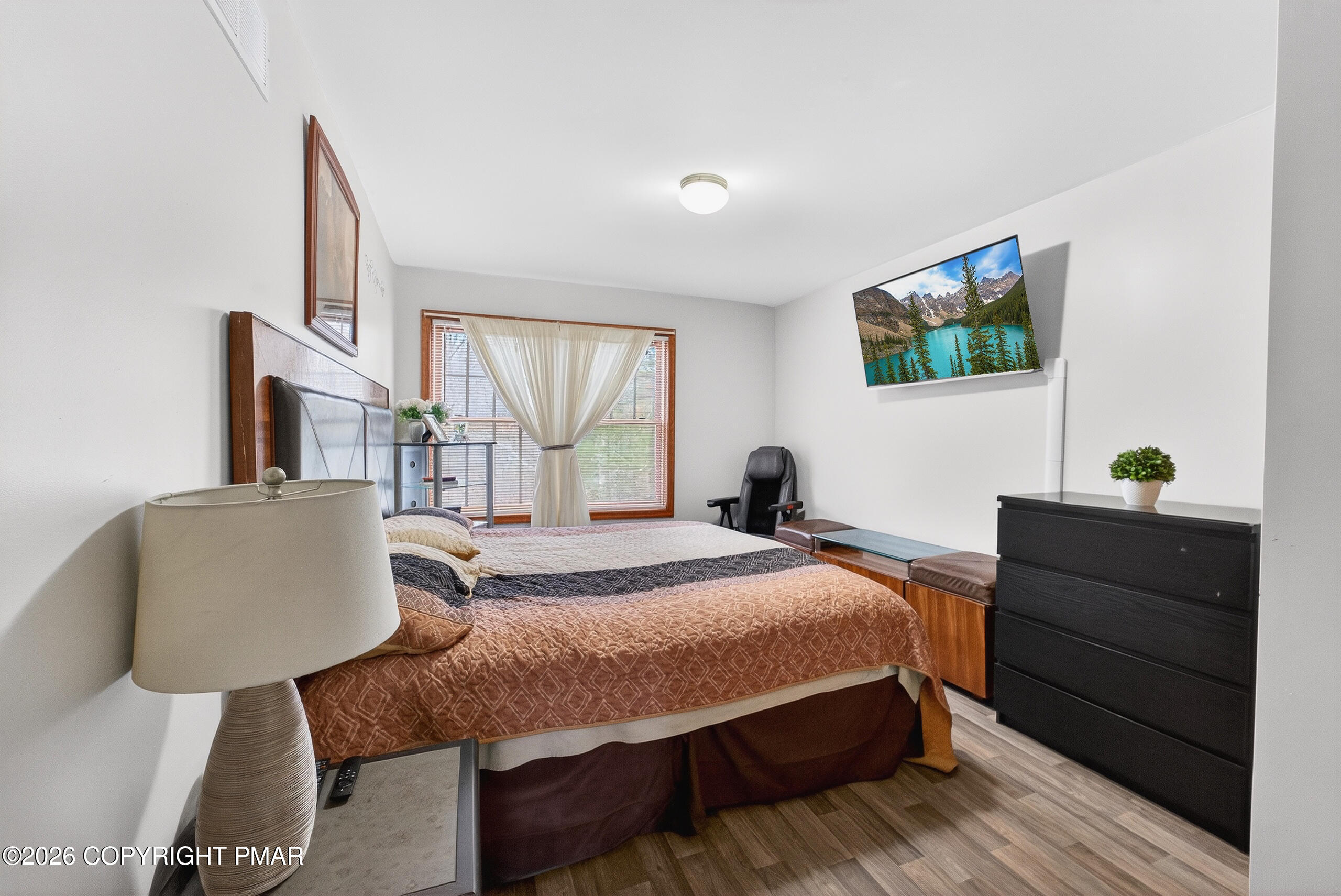 6293 Decker Road Bushkill, PA 18324 - Photo 24 of 38 a bedroom with a bed and wooden floor