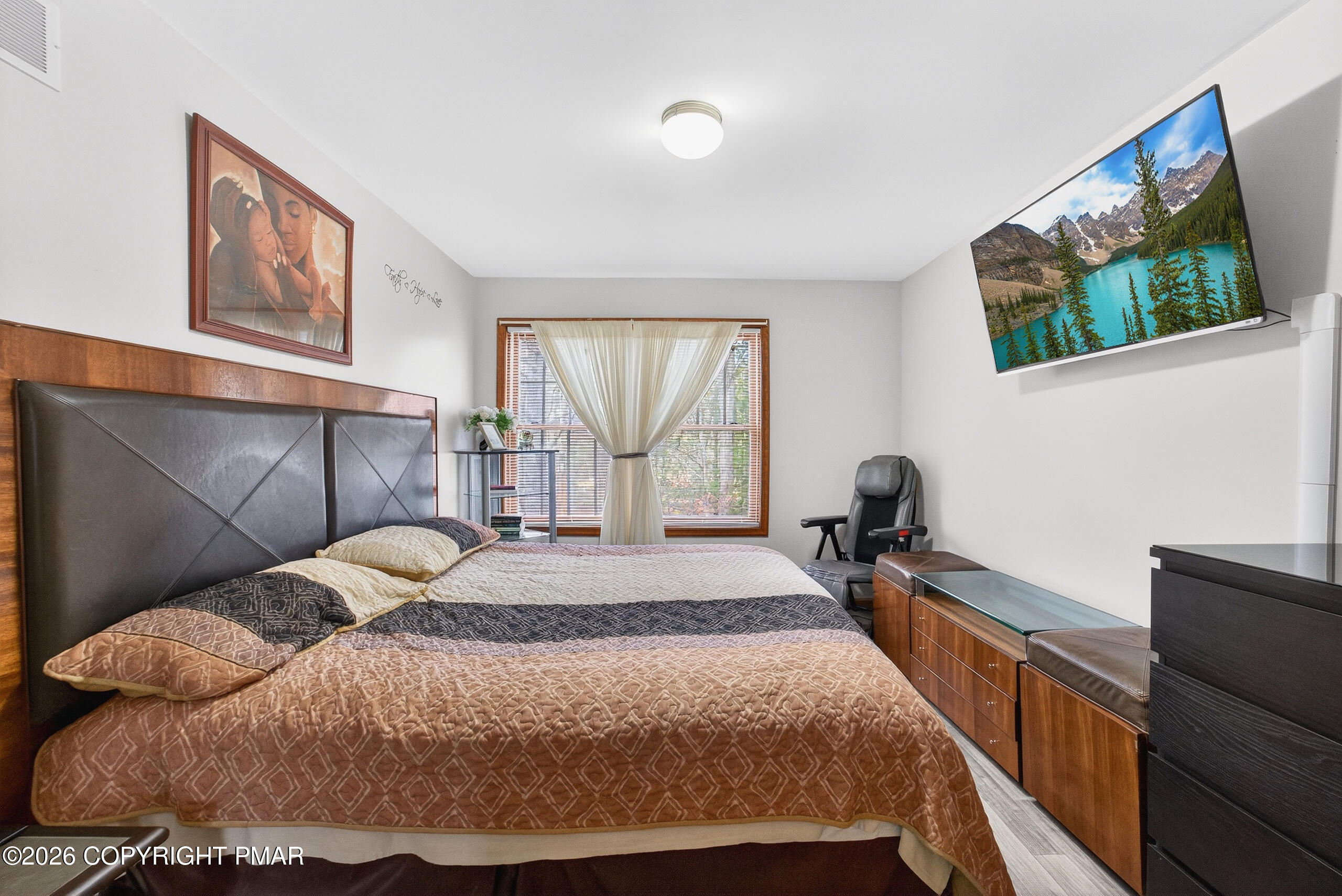 6293 Decker Road Bushkill, PA 18324 - Photo 25 of 38 a bed sitting in a bedroom next to a window