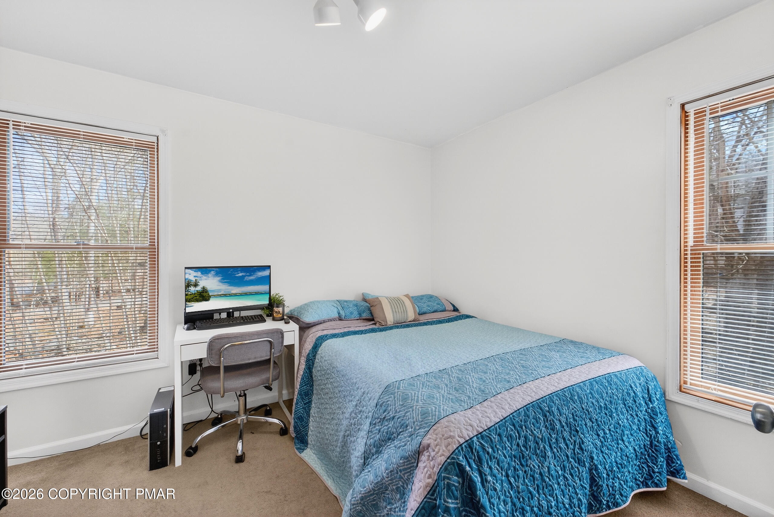 6293 Decker Road Bushkill, PA 18324 - Photo 26 of 38 a bedroom with a bed and a desk next to a window