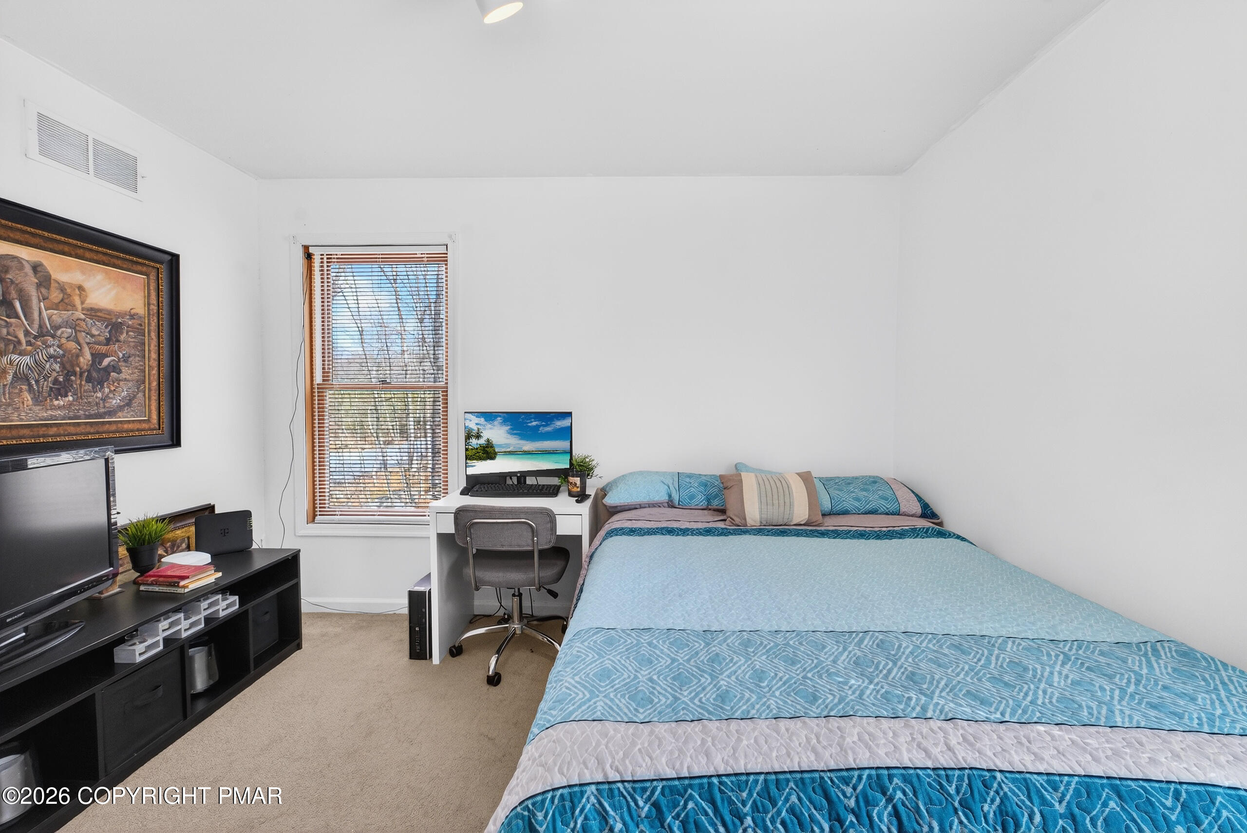 6293 Decker Road Bushkill, PA 18324 - Photo 27 of 38 a bedroom with furniture and a window