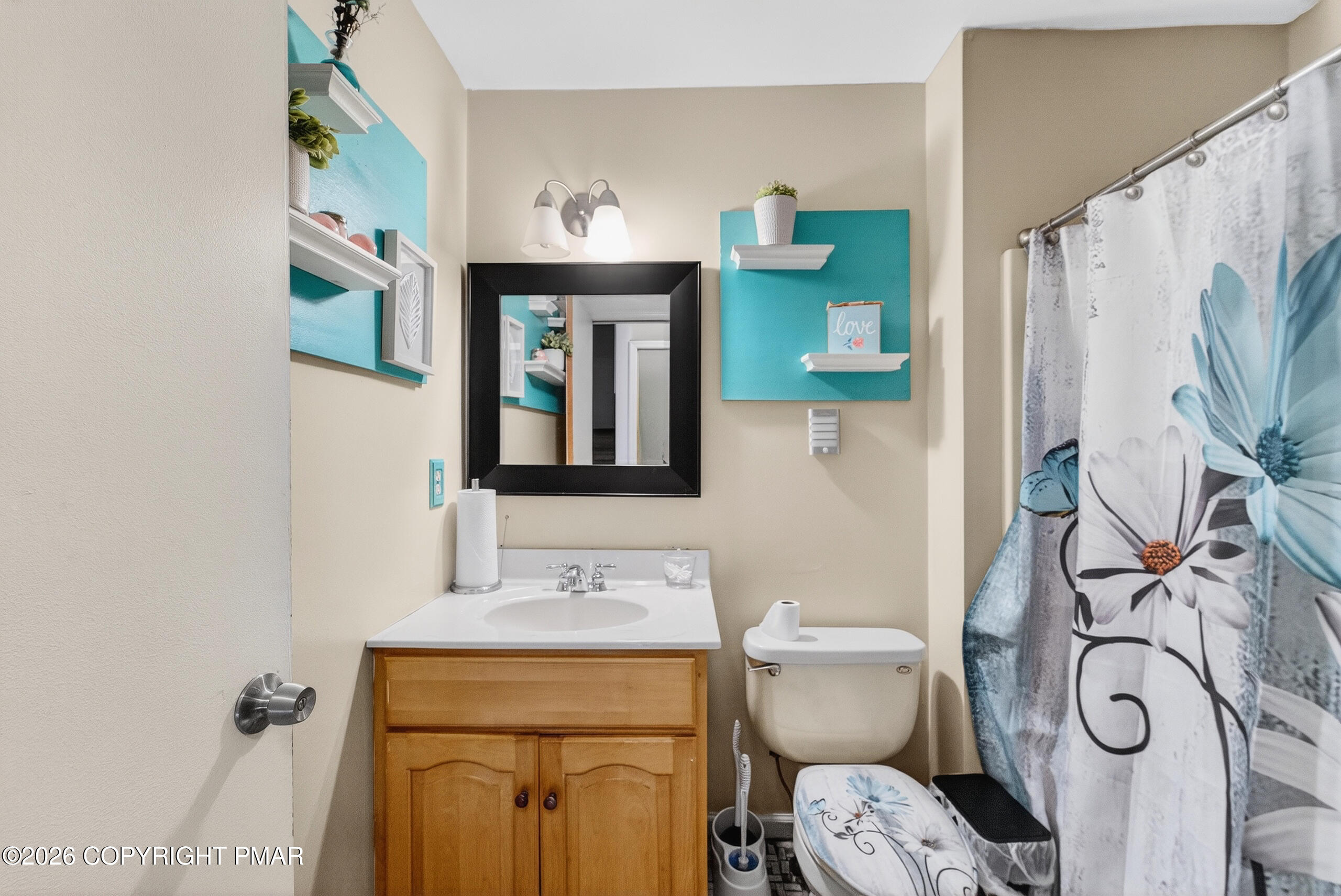 6293 Decker Road Bushkill, PA 18324 - Photo 28 of 38 a bathroom with a toilet sink and mirror