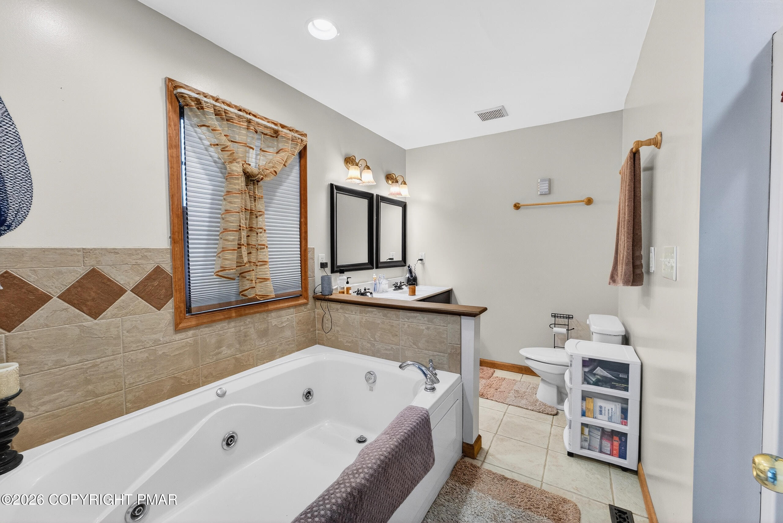 6293 Decker Road Bushkill, PA 18324 - Photo 32 of 38 a bathroom with a bathtub sink and a mirror