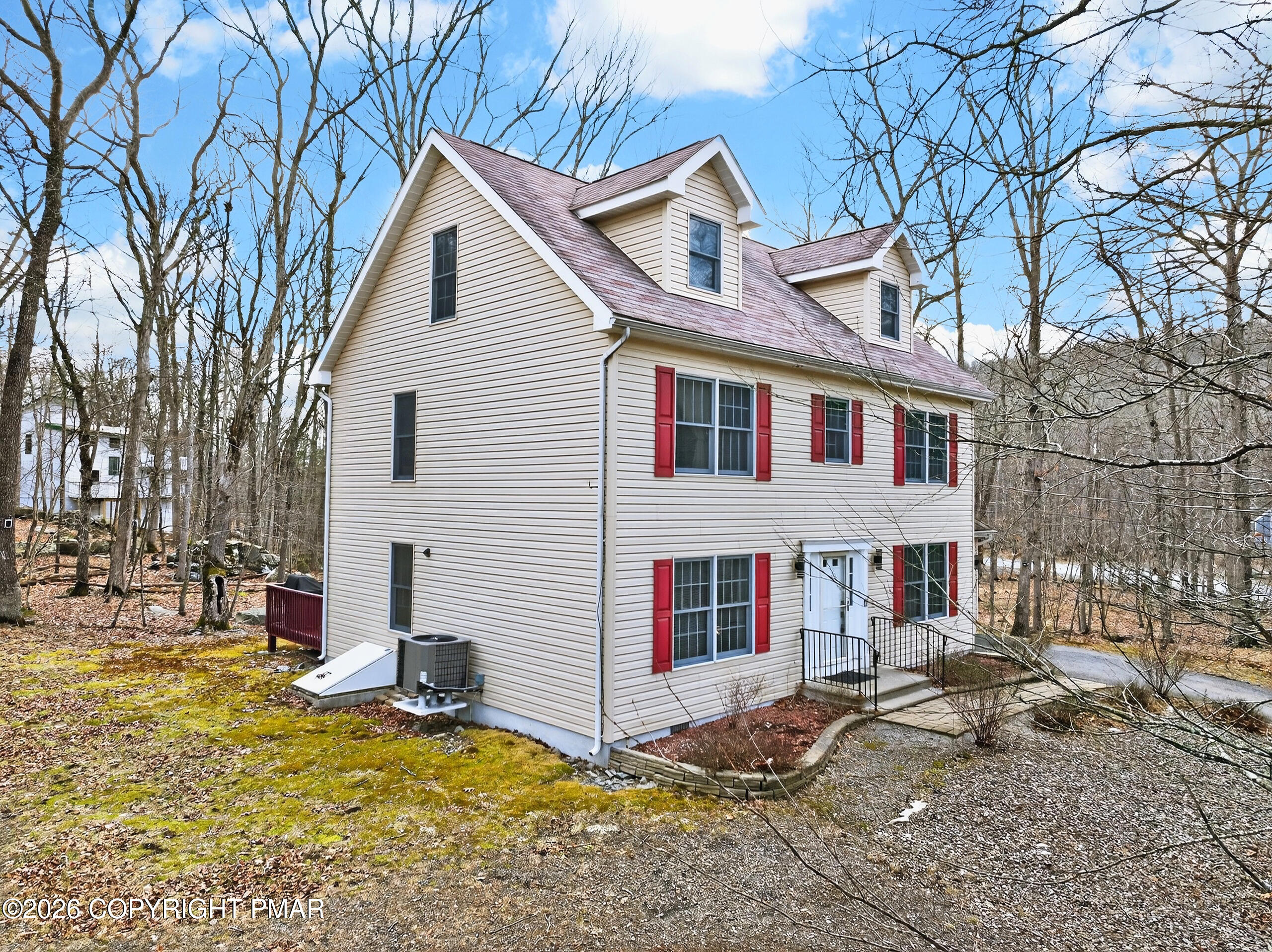 6293 Decker Road Bushkill, PA 18324 - Photo 4 of 38 a view of a white house with a large tree in front of it