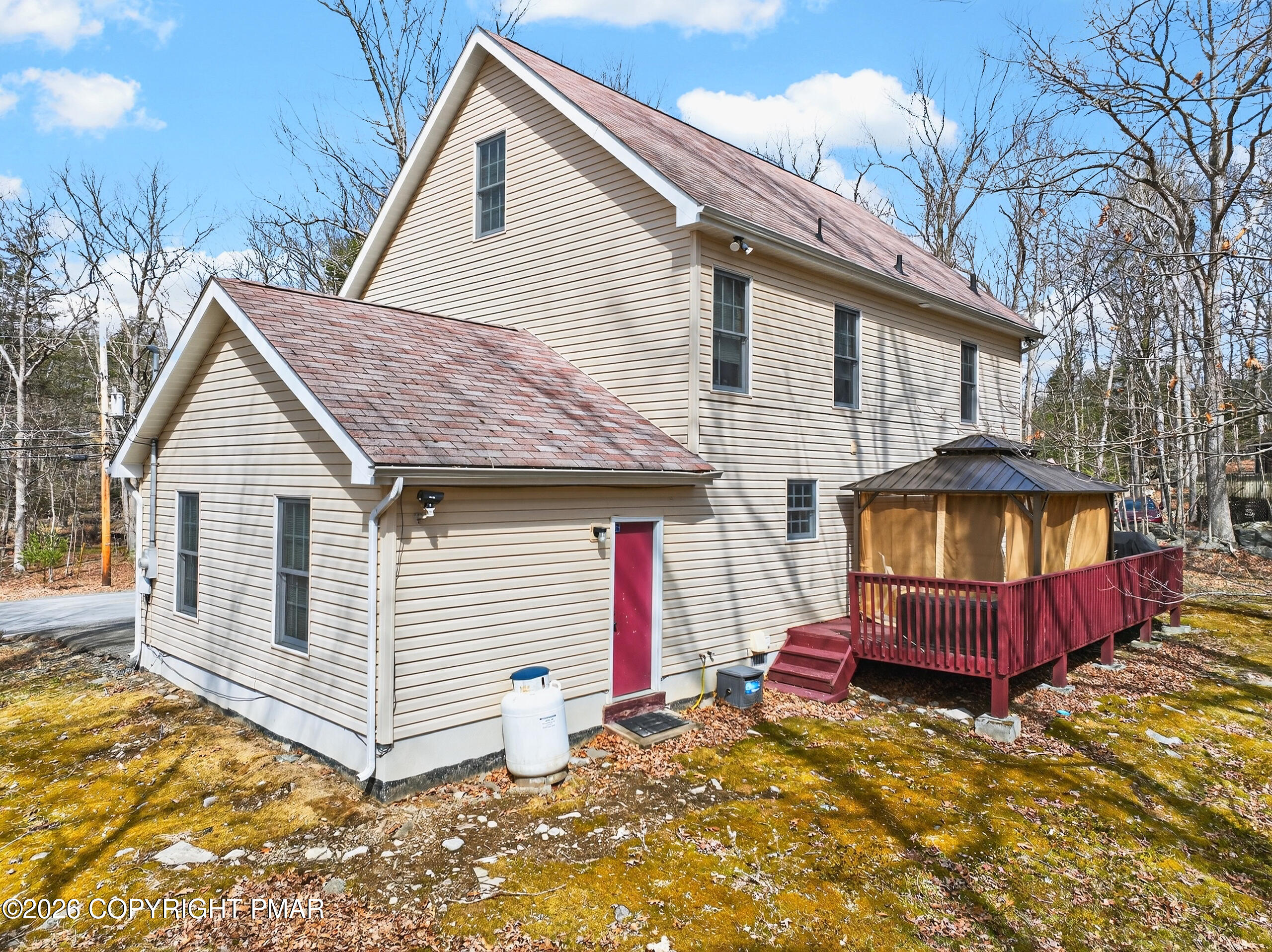 6293 Decker Road Bushkill, PA 18324 - Photo 7 of 38 a view of a house with a yard and wooden fence