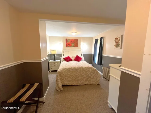 a bedroom with a bed and a closet