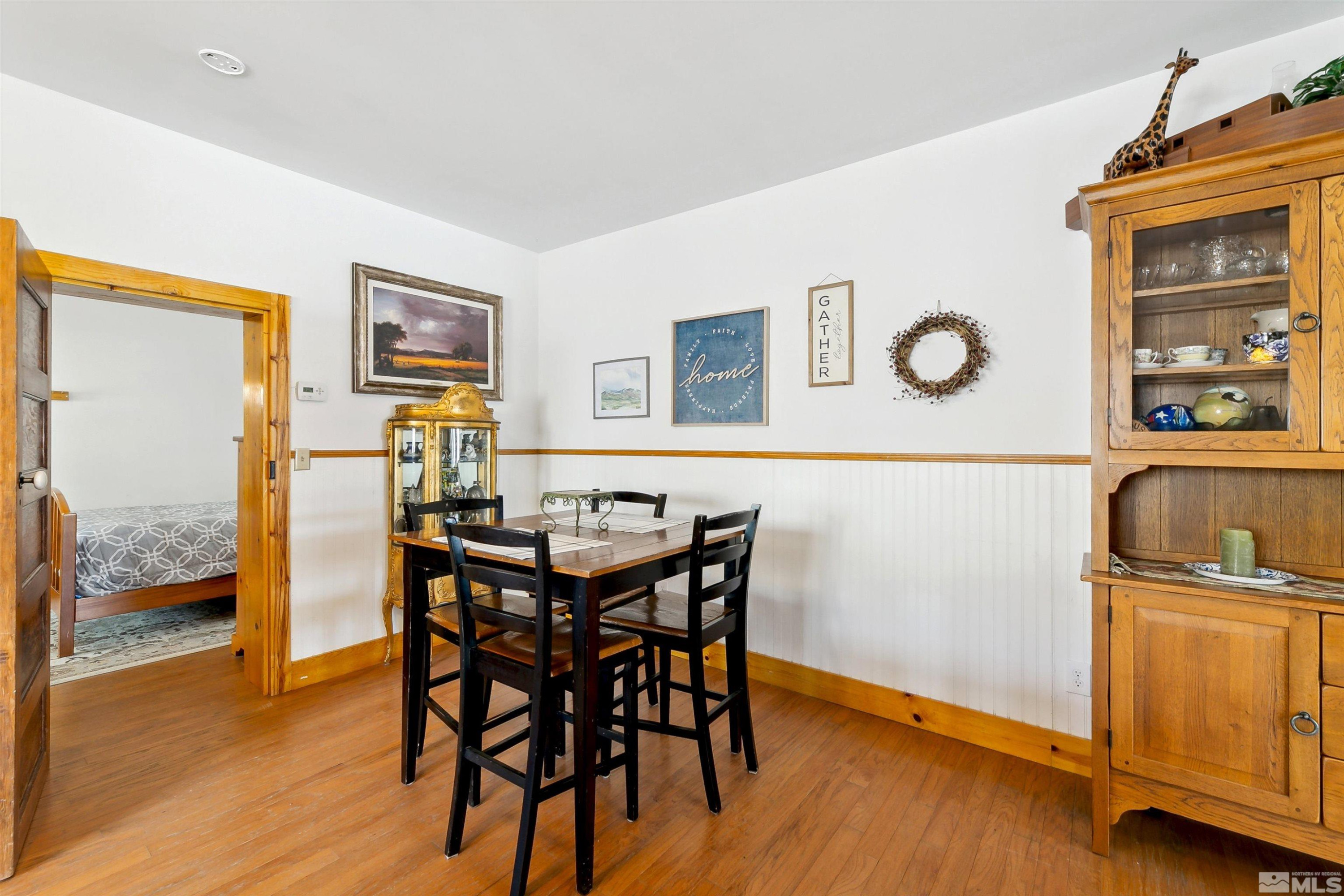 55 Main Street Dayton, NV 89403 - Photo 15 of 23 a view of a dining room with furniture and wooden floor