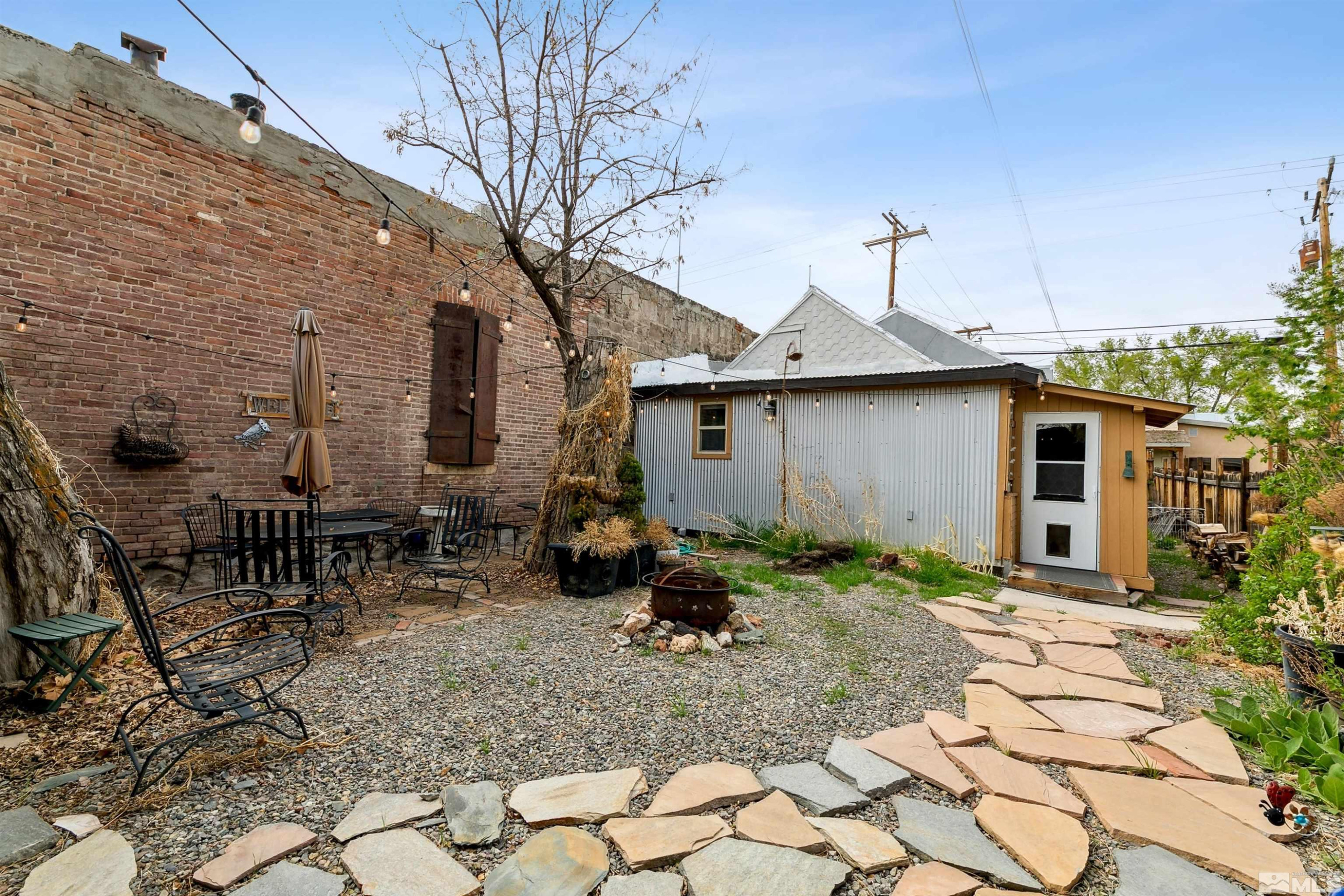 55 Main Street Dayton, NV 89403 - Photo 21 of 23 a backyard of a house with yard and outdoor seating
