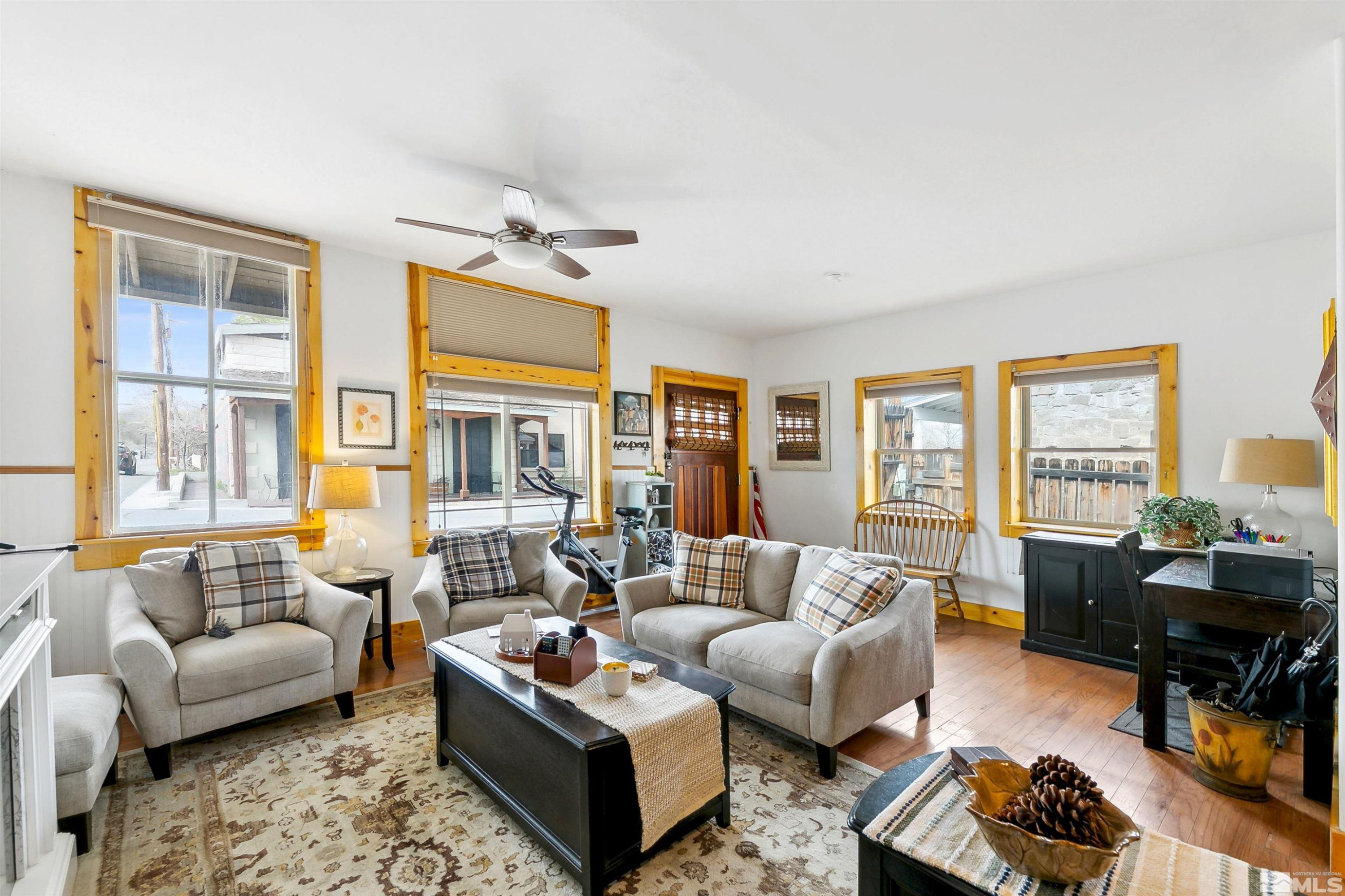 55 Main Street Dayton, NV 89403 - Photo 6 of 23 a living room with furniture ceiling fan and a window