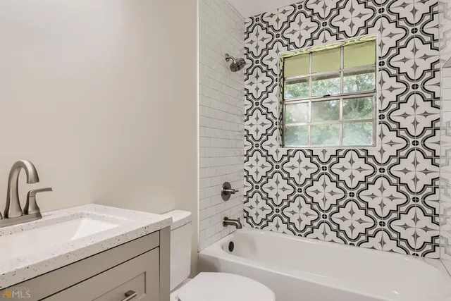 a bathroom with a sink and a bathtub