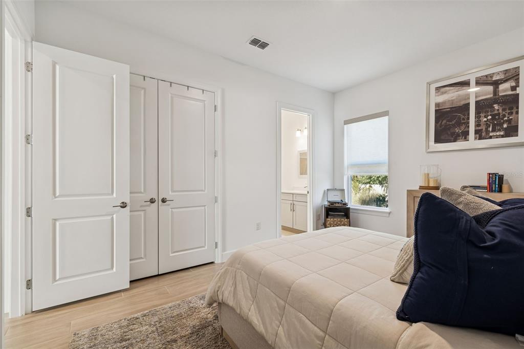 4848 Rosatti Road Wesley Chapel, FL 33543 - Photo 17 of 90 a bedroom with a bed and a window