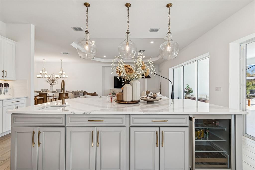 4848 Rosatti Road Wesley Chapel, FL 33543 - Photo 31 of 90 a view of a kitchen with kitchen island granite countertop living room