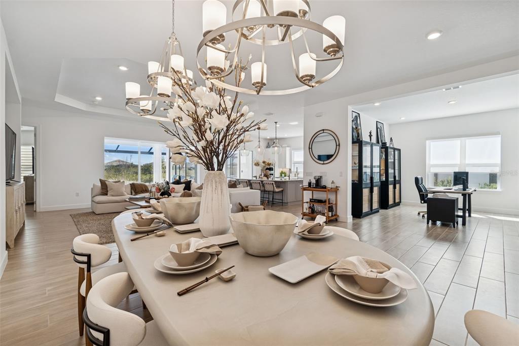 4848 Rosatti Road Wesley Chapel, FL 33543 - Photo 36 of 90 a living room with furniture a chandelier and a chandelier