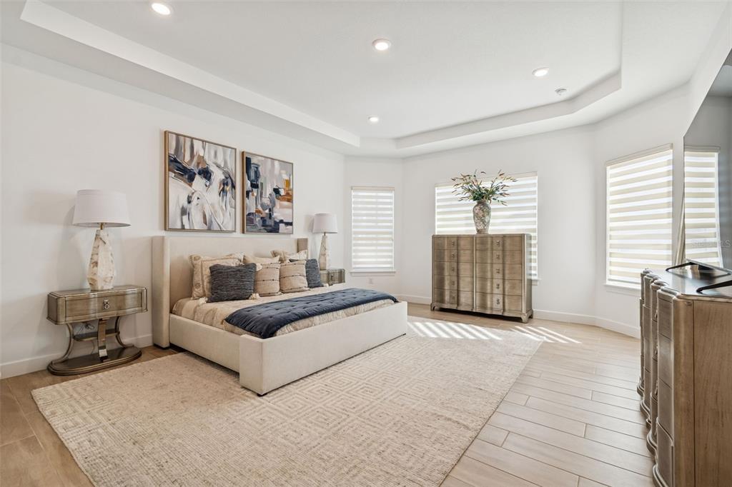 4848 Rosatti Road Wesley Chapel, FL 33543 - Photo 40 of 90 a spacious bedroom with a bed and a couch