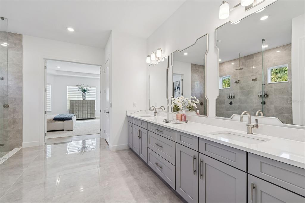 4848 Rosatti Road Wesley Chapel, FL 33543 - Photo 45 of 90 a spacious bathroom with a double vanity sink mirror and shower