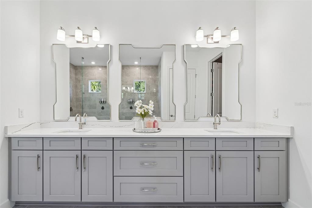 4848 Rosatti Road Wesley Chapel, FL 33543 - Photo 46 of 90 a bathroom with a sink vanity and mirror