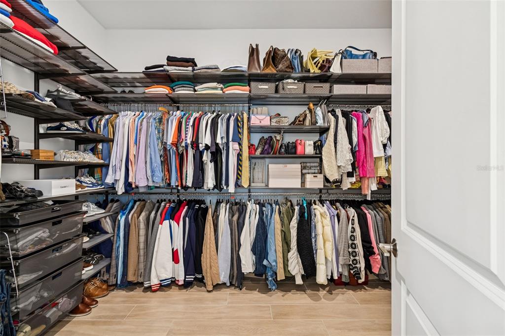 4848 Rosatti Road Wesley Chapel, FL 33543 - Photo 47 of 90 a view of walk in closet with clothes