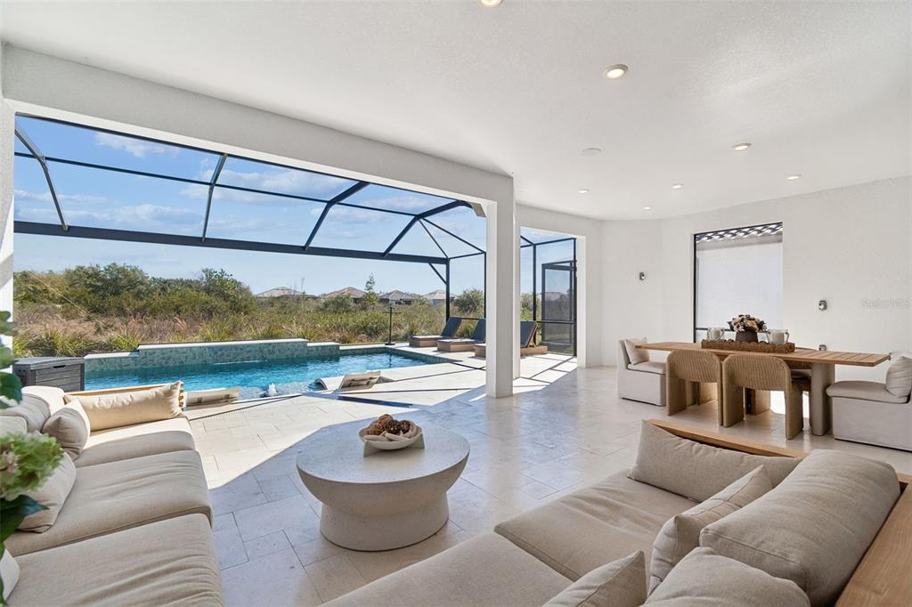 4848 Rosatti Road Wesley Chapel, FL 33543 - Photo 50 of 90 a living room with furniture and a large window