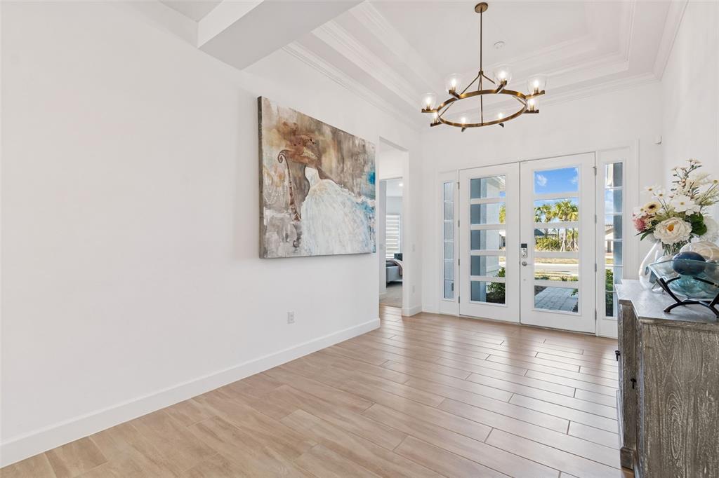 4848 Rosatti Road Wesley Chapel, FL 33543 - Photo 5 of 90 a view of an empty room with wooden floor and a window