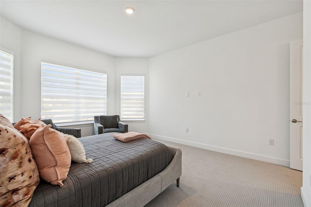 4848 Rosatti Road Wesley Chapel, FL 33543 - Photo 9 of 90 a bedroom with a bed and window