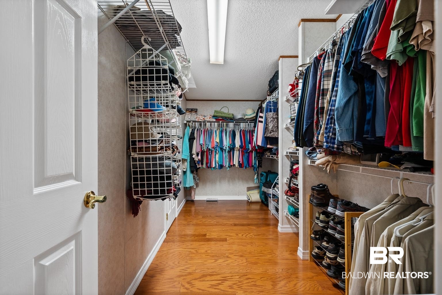 10647 Rte Road Lillian, AL 36549 - Photo 51 of 62 Walk in closet featuring wood finished floors