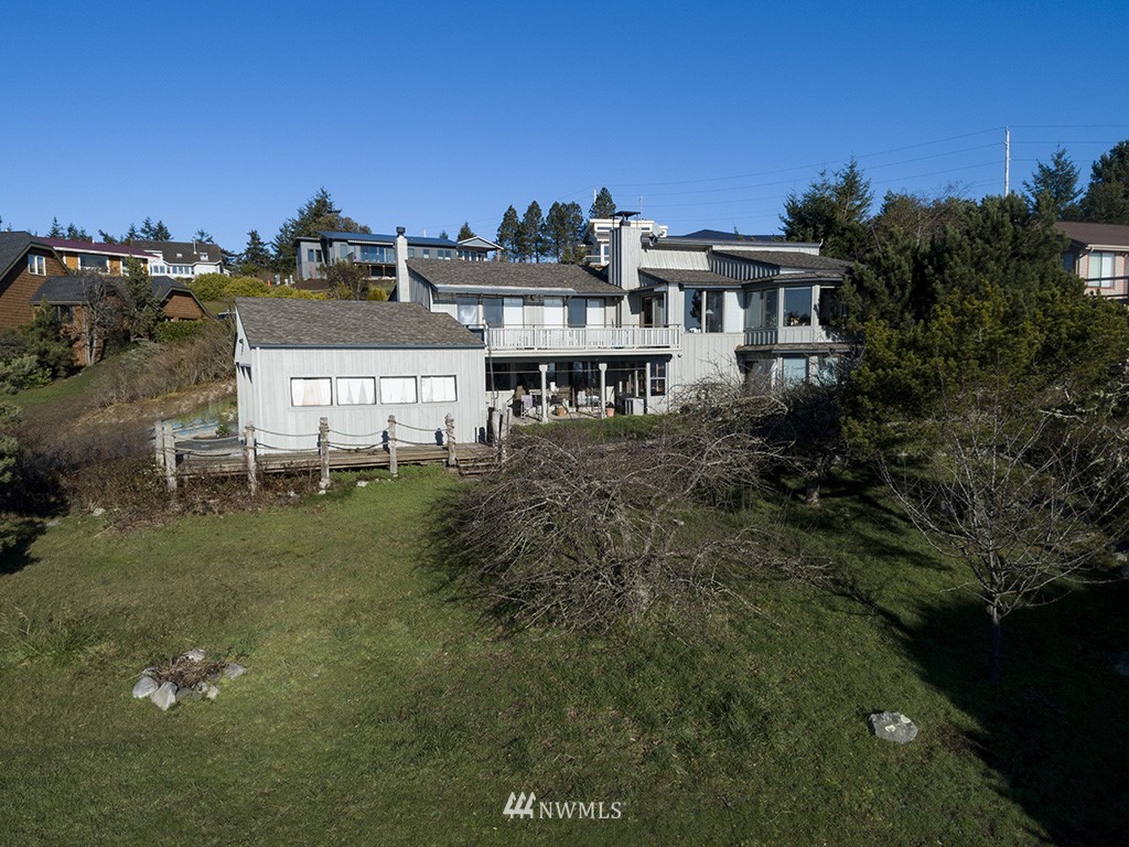 164 Pelican Way Friday Harbor, WA 98250 - Photo 1 of 13 a aerial view of residential houses with outdoor space and trees