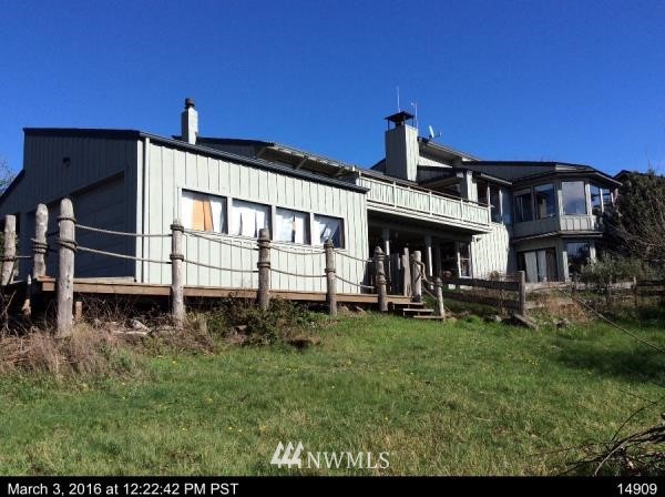 164 Pelican Way Friday Harbor, WA 98250 - Photo 6 of 13 a front view of a house with a garden