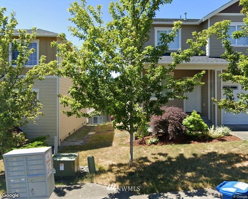 560 Elma Place Northeast Renton, WA 98059 - Photo 1 of 1 a front view of a house with a yard