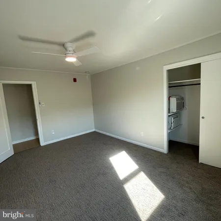 a view of an empty room and a window