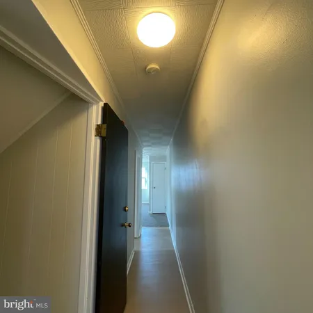 a view of hallway with stairs