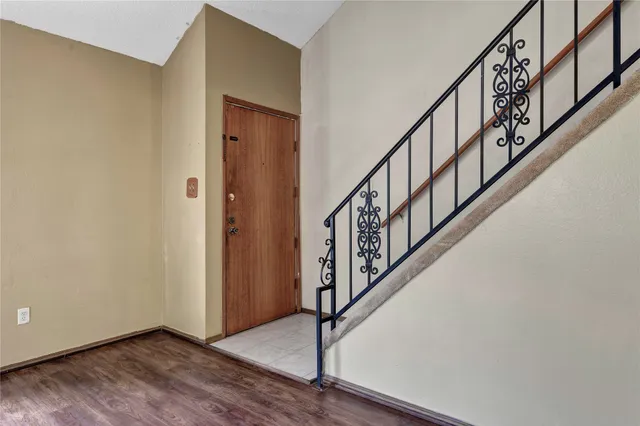 a view of an entryway with wooden floor