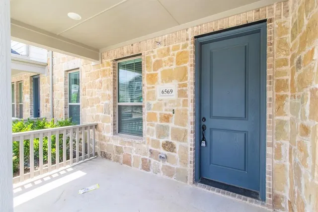 a view of a balcony with wooden fence