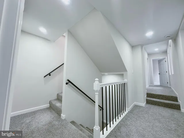 a view of a hallway view with staircase