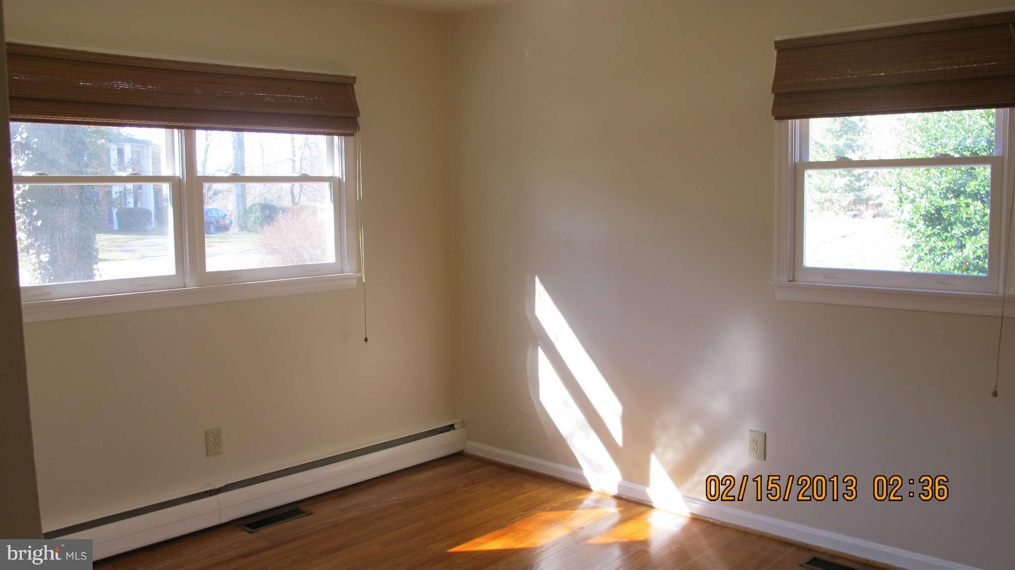 8221 Higham Road Lorton, VA 22079 - Photo 16 of 30 Master Bedroom with hardwoods and ceiling fan