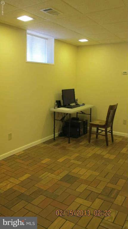 8221 Higham Road Lorton, VA 22079 - Photo 23 of 30 Den with stone floor