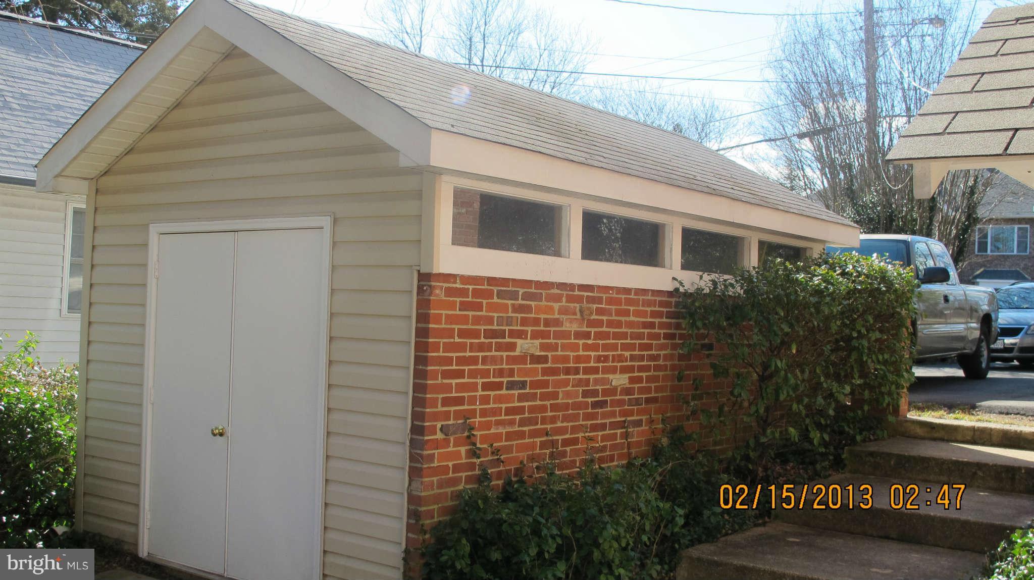 8221 Higham Road Lorton, VA 22079 - Photo 29 of 30 Brick shed with windows