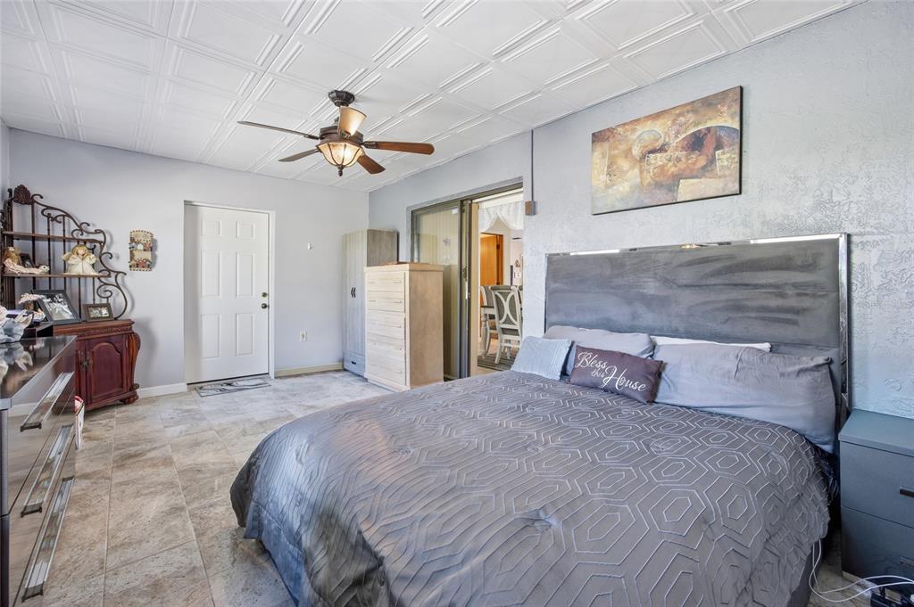 5141 East Backner Lane Inverness, FL 34452 - Photo 25 of 31 a bedroom with a bed and a walk in closet