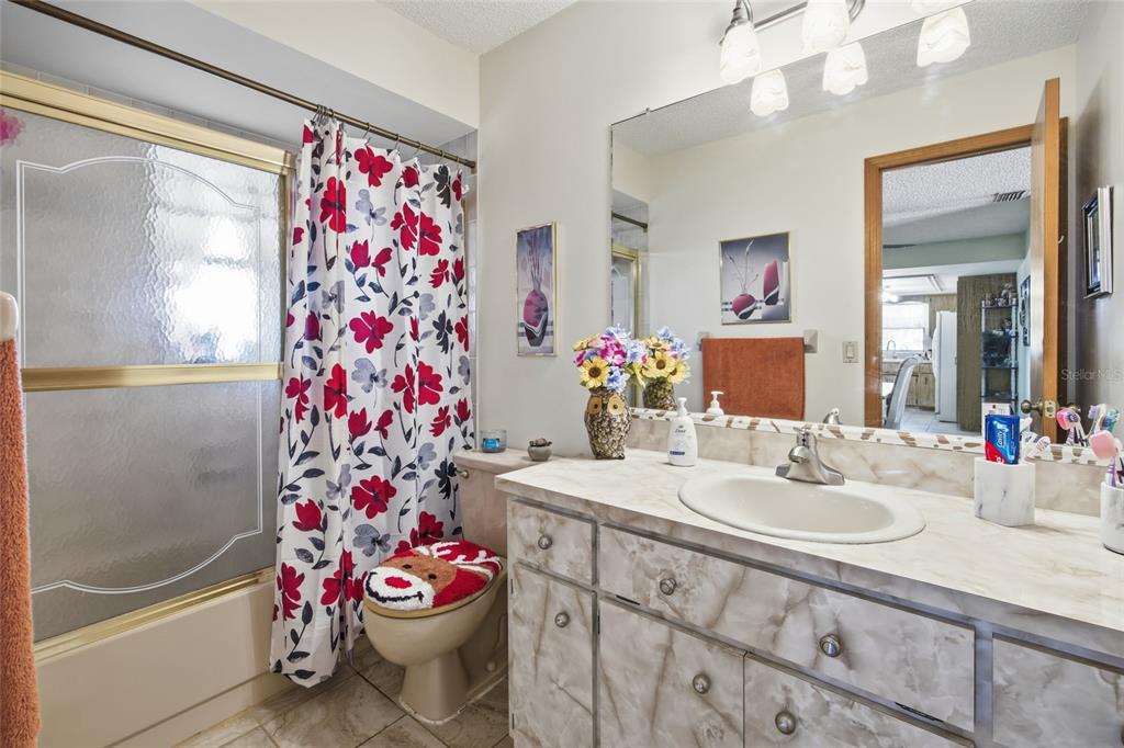 5141 East Backner Lane Inverness, FL 34452 - Photo 27 of 31 a bathroom with a sink toilet and shower